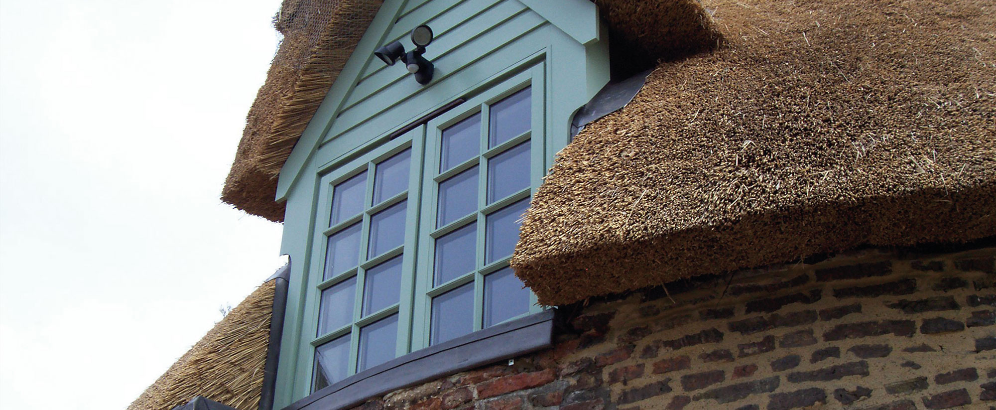 Casement Window on Thatched Roof